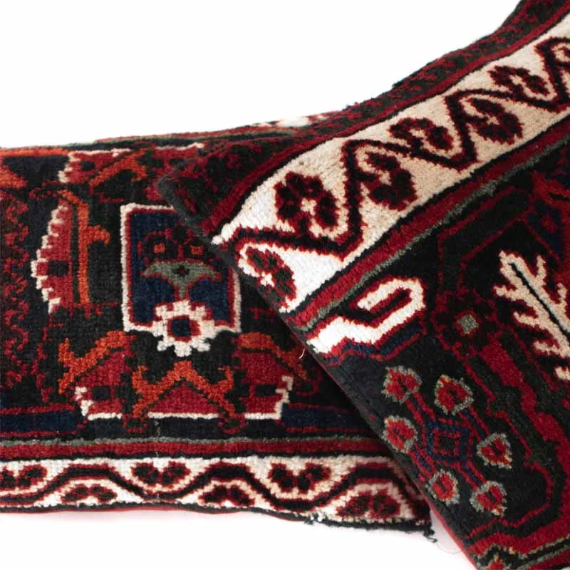 Close-up detail of handwoven texture and natural dyes in authentic Persian carpet