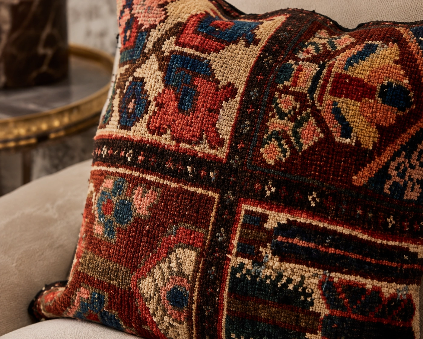 Close-up detail of an original handwoven Persian rug cushion with rich texture and refined finishing